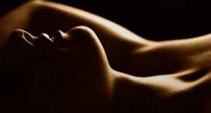 a woman lying down with her arms up