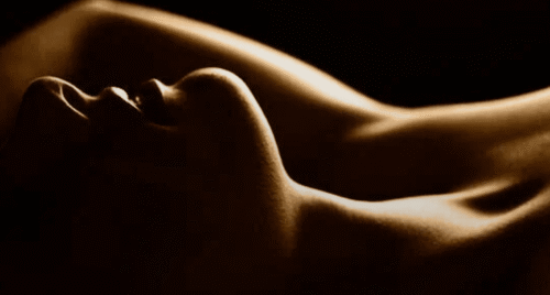 a woman lying down with her arms up