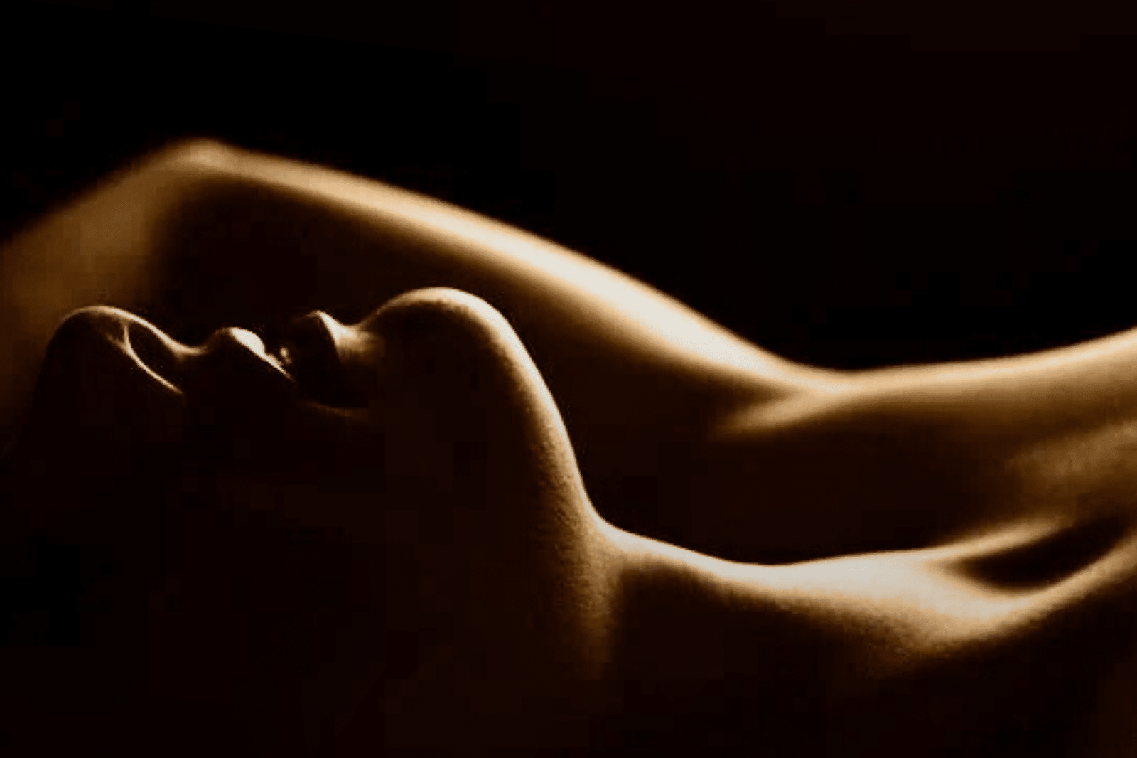 a woman lying down with her arms up